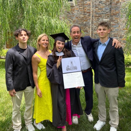 Julian Kal Seinfeld with his parents and brother during Sascha Seinfeld's graduation.